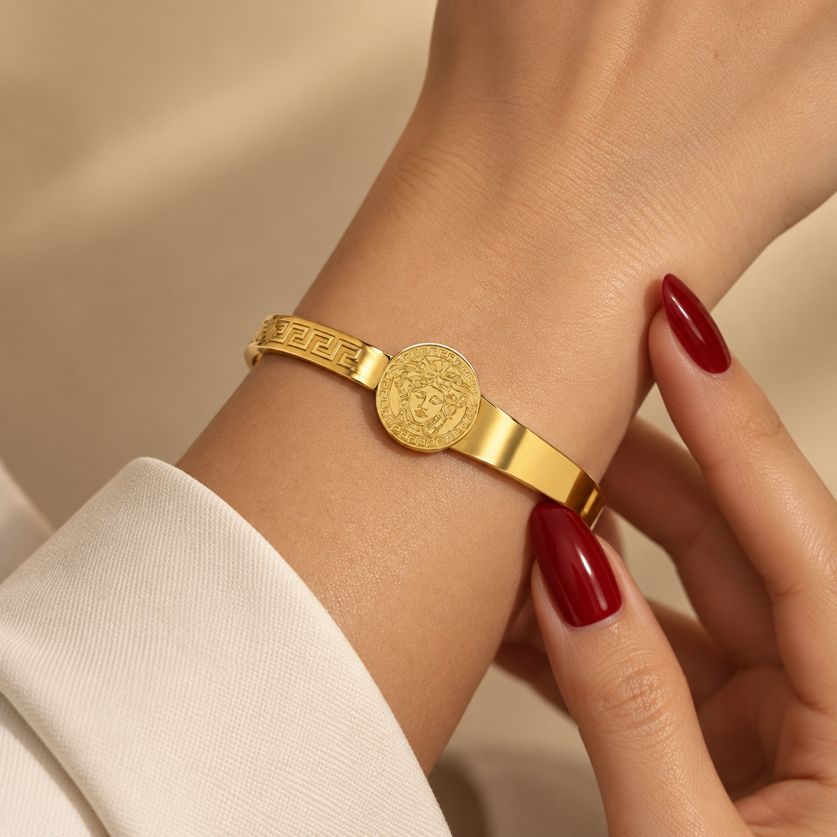Stainless steel bracelet featuring the Medusa medallion and Greek key motif.