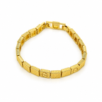Gold stainless steel bracelet featuring a faceted cube design and screw engravings.