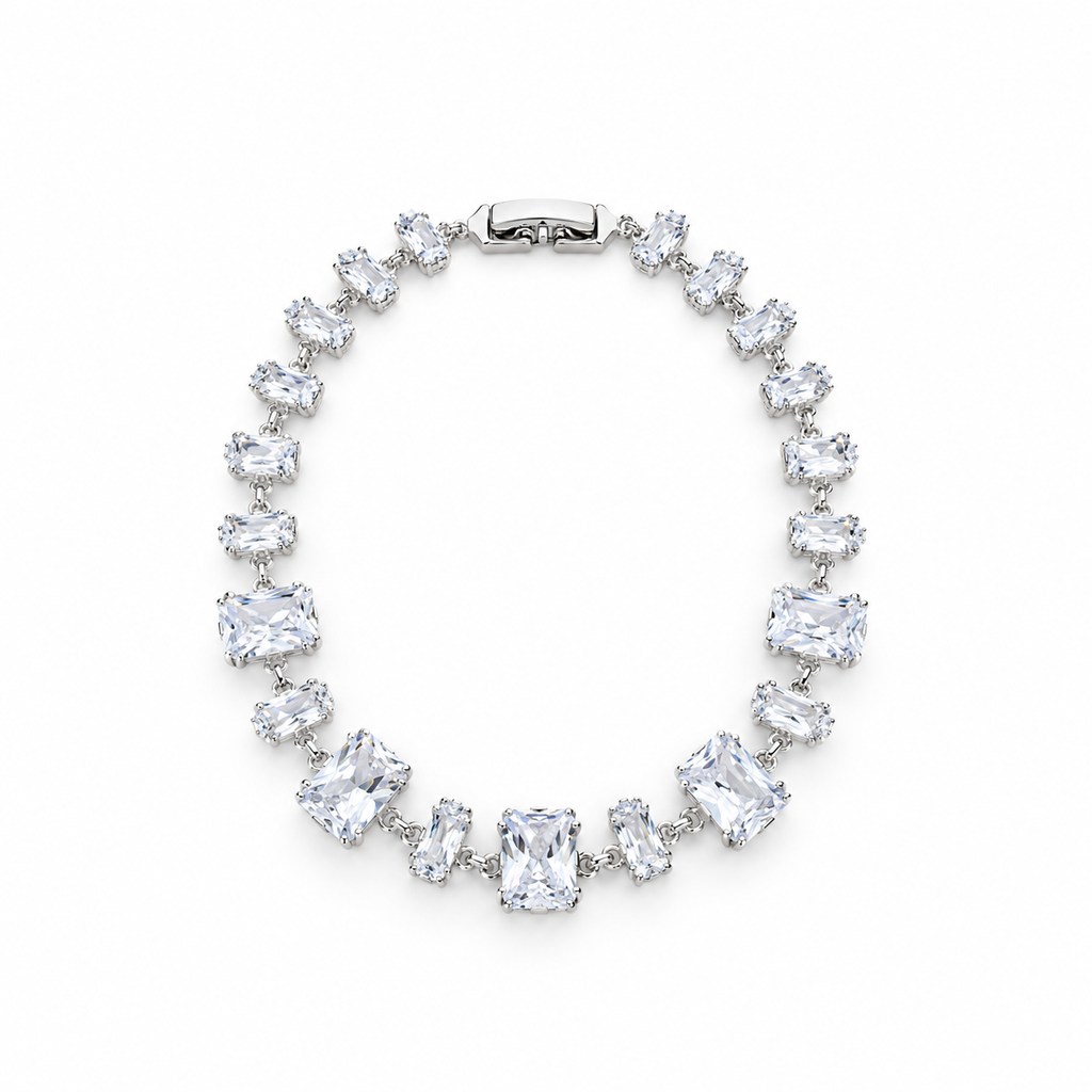 Silver stainless steel tennis bracelet featuring graduated rectangular zirconia stones.