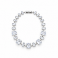 Silver stainless steel tennis bracelet featuring graduated rectangular zirconia stones.