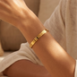 The classic "Love Prestige" bracelet – gold-plated stainless steel with an iconic design