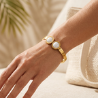Luxury stainless steel bracelet with geometric patterns and opposing circles - shiny gold