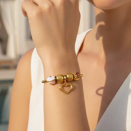 "Heartprint" gold bracelet - a modern design with playful charms