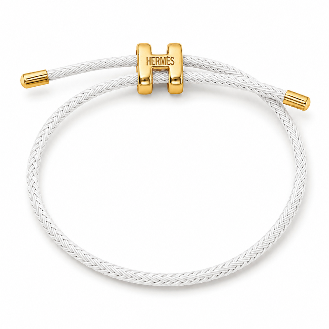 A trendy braided rope bracelet with a gold-tone H charm.
