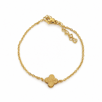 A delicate bracelet with a sandy clover charm