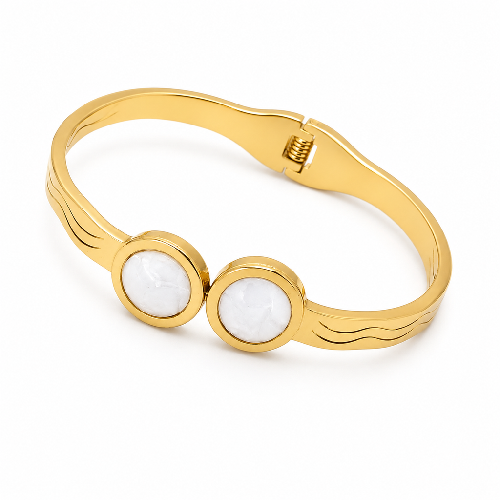 Luxury stainless steel bracelet with geometric patterns and opposing circles - shiny gold